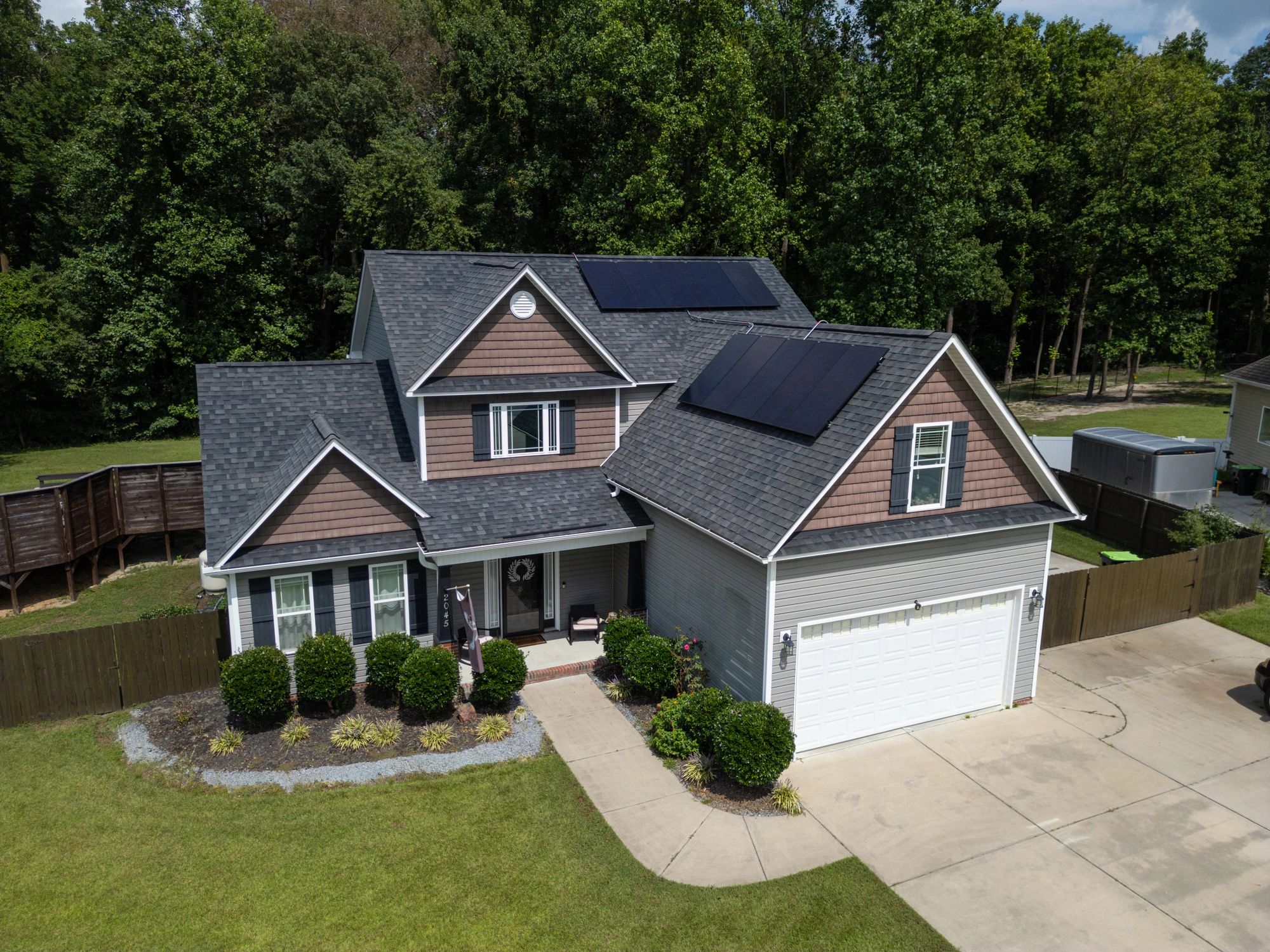 Modern custom home exterior with solar panels